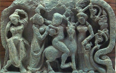 Satyr on a mountain goat, drinking with women
